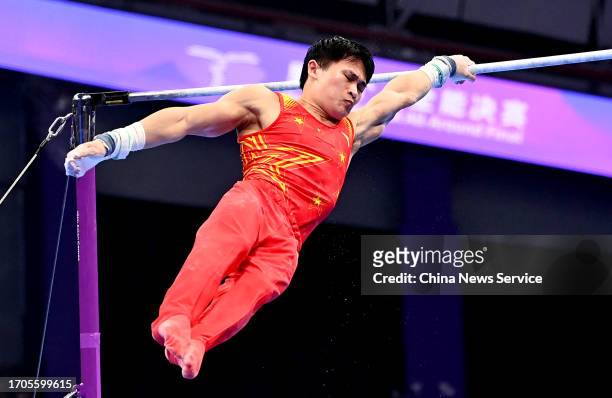 Lan Xingyu of Team China competes on the Horizontal Bar in the Artistic Gymnastics - Men's All-Around Final on day three of the 19th Asian Games at...