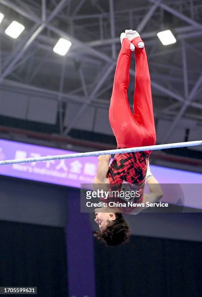 Takeru Kitazono of Team Japan competes on the Horizontal Bar in the Artistic Gymnastics - Men's All-Around Final on day three of the 19th Asian Games...