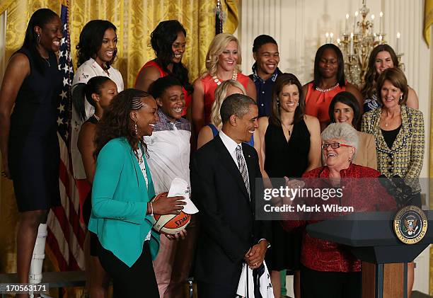 President Barack Obama , listens to coach Lin Dunn , speak during an event to honor the reigning WNBA champion Indiana Fever, at the White House,...