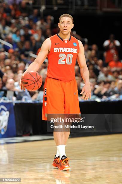 Brandon Triche of the Syracuse Orange dribbles the ball during the East Regional Round Final of the 2013 NCAA Men's Basketball Tournament game...