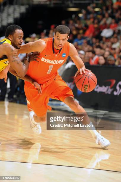 Michael-Carter-WIlliams of the Syracuse Orange dribbles the ball during the East Regional Round Final of the 2013 NCAA Men's Basketball Tournament...