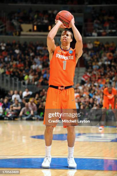 Michael-Carter-WIlliams of the Syracuse Orange takes a foul shot during the East Regional Round Final of the 2013 NCAA Men's Basketball Tournament...