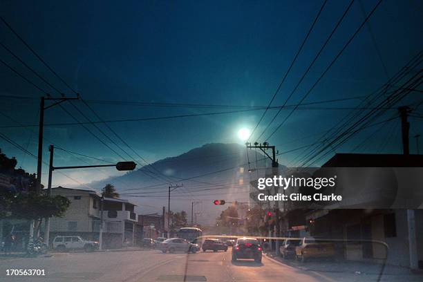 Through a taxi's window, I view the Volcan de San Salvador at sunset from downtown May 16, 2013 in San Salvador.