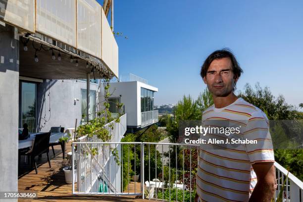 Los Angeles, CA Aleksandar Jovanovic, a Airbnb landlord, stands on the deck of his Los Angeles home. His tenant, Elizabeth Hirschhorn, not pictured,...