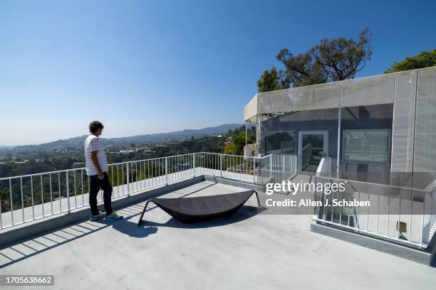 Los Angeles, CA Aleksandar Jovanovic, a Airbnb landlord, looks out over a patio space on top his guesthouse, located on the property of his Los...