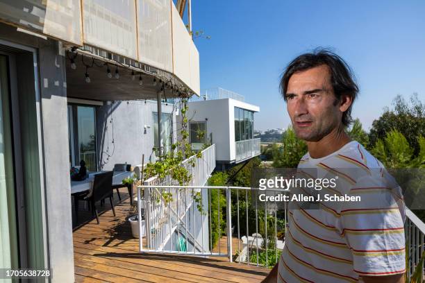 Los Angeles, CA Aleksandar Jovanovic, a Airbnb landlord, stands on the deck of his Los Angeles home. His tenant, Elizabeth Hirschhorn, not pictured,...