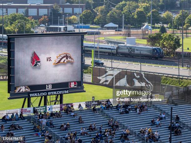 An Amtrak passenger train passes by Waldo Stadium during the college football game between the Ball State Cardinals and Western Michigan Broncos on...