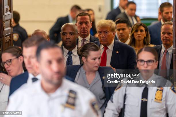 Former President Donald Trump steps out of court during an afternoon break on the third day of his civil fraud trial at New York State Supreme Court...