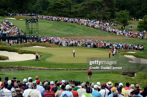 Tiger Woods of the United States misses his putt for birdie on the ninth hole during Round Two of the 113th U.S. Open at Merion Golf Club on June 14,...