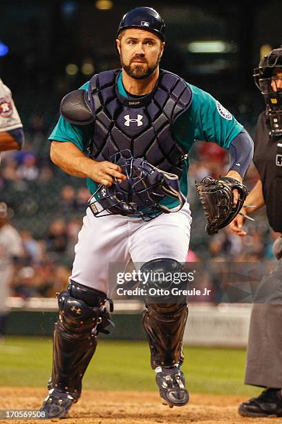 Catcher Kelly Shoppach of the Seattle Mariners chases a foul ball against the Houston Astros at Safeco Field on June 10, 2013 in Seattle, Washington.