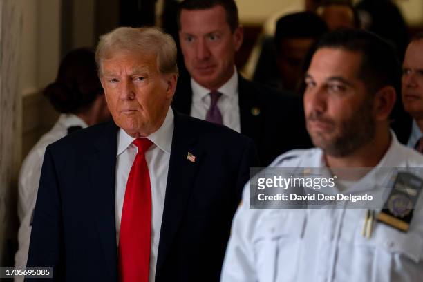 Former President Donald Trump steps out of court during a afternoon break on the third day of his civil fraud trial at New York State Supreme Court...