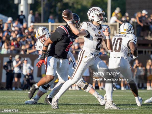 Western Michigan Broncos quarterback Treyson Bourguet passes the ball to his teammate during the college football game between the Ball State...