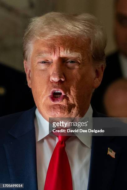 Former President Donald Trump speaks to the media during an afternoon break on the third day of his civil fraud trial at New York State Supreme Court...