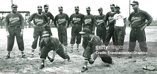 Teammates on the Indianapolis Clowns of the National Negro Leagues work out in a photograph around 1950 in Indianapolis, Indiana.