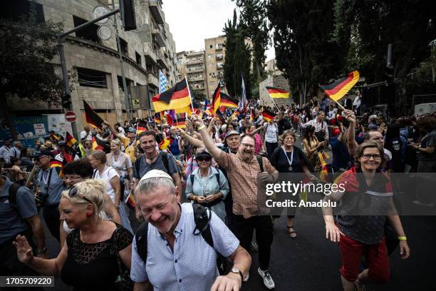 People attend an annual parade during the Jewish holiday of Sukkot in Jerusalem on October 04, 2023. In West Jerusalem, thousands joined the annual...