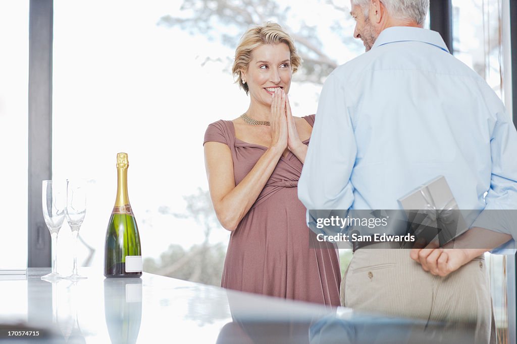 Man giving wife anniversary gift