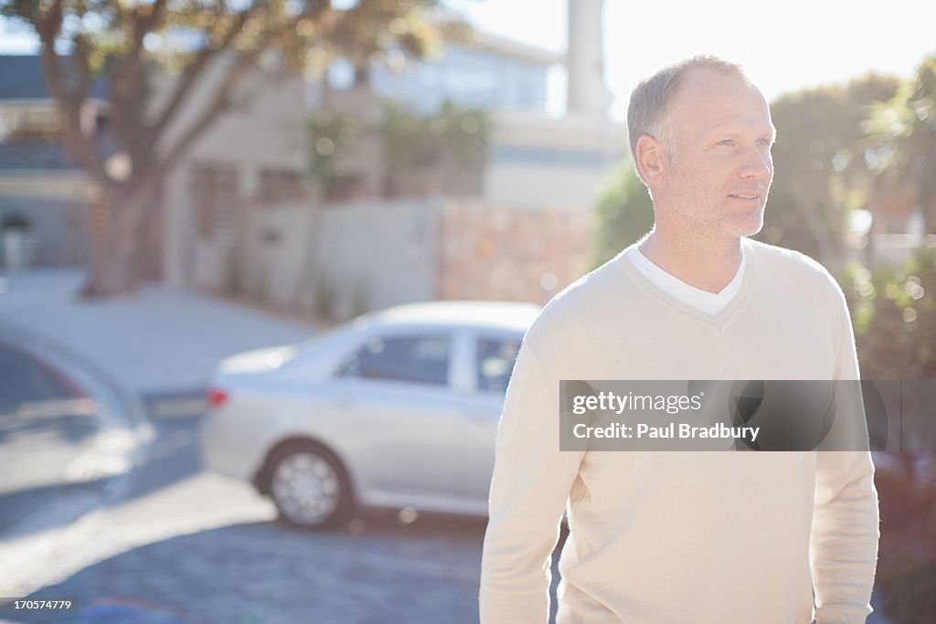 Mature man in driveway