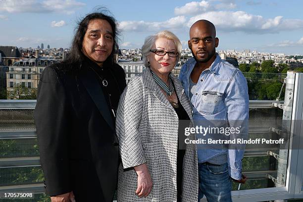 Josiane Balasko bstanding between her husband George Aguilar and her son Rudy Berry - Actress Josiane Balasko receives the Medal of Arts and Letters...