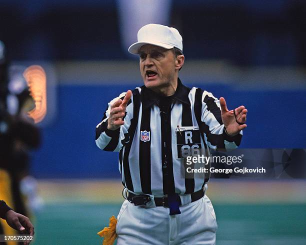 National Football League referee Bernie Kukar signals during a game between the Cincinnati Bengals and Pittsburgh Steelers at Three Rivers Stadium on...