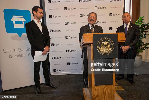 San Francisco Mayor Edward "Ed" Lee, center, speaks as Jack Dorsey, chairman and co-founder of Twitter Inc., left, and New York City Mayor Michael...