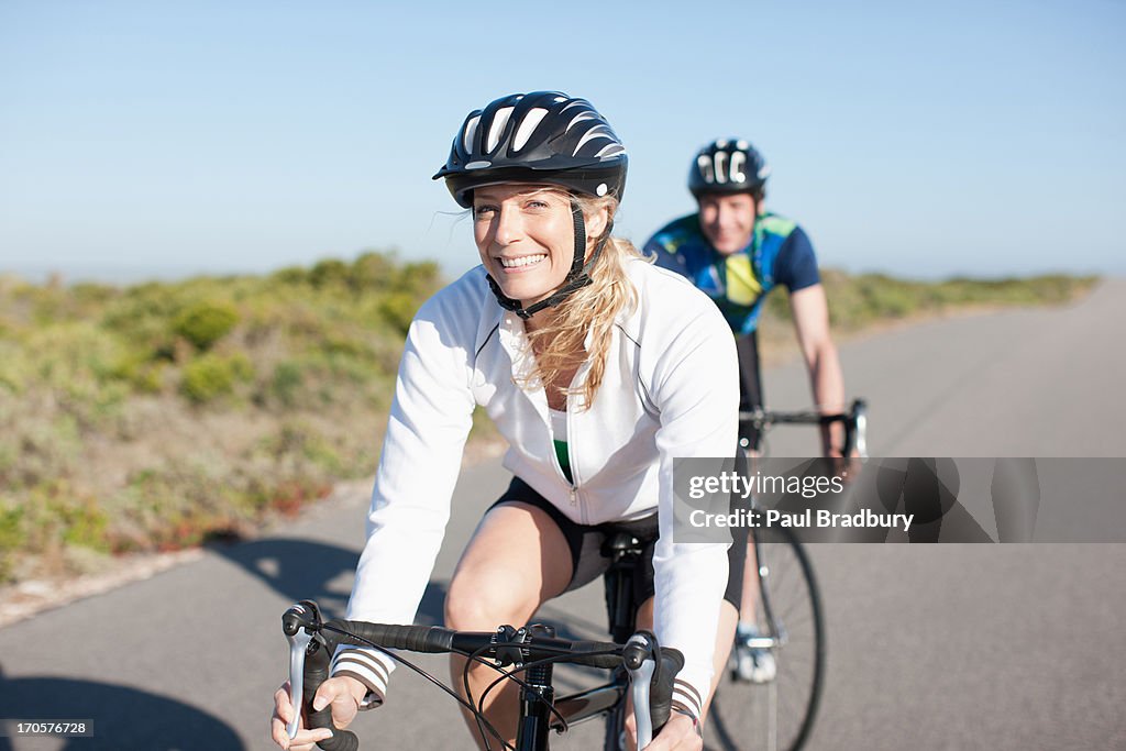 Couple bicycle riding in remote area