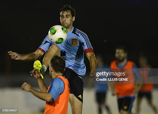 Spain's defenders Raul Albiol and Jordi Alba take part in a during a training session at the Wilson Campos Training Centre near Recife, northeastern...