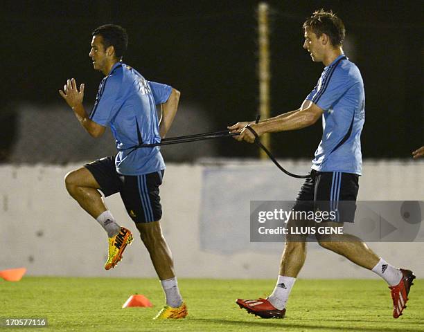 Spanish forward Pedro Rodriguez and defender Nacho Monreal take part in a training session at the Wilson Campos Training Center near Recife,...
