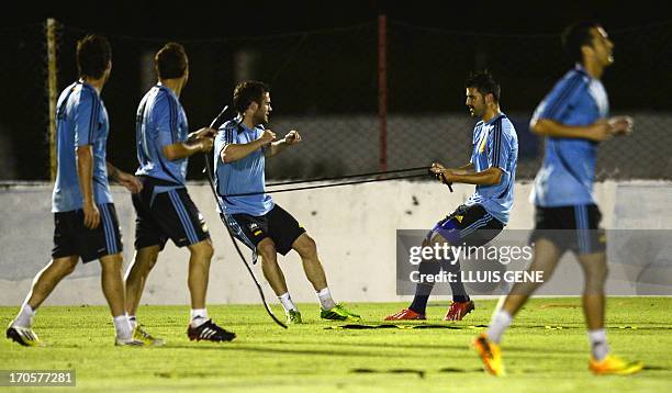Spanish forward Juan Mata and forward David Villa take part in a training session at the Wilson Campos Training Center near Recife, northeastern...