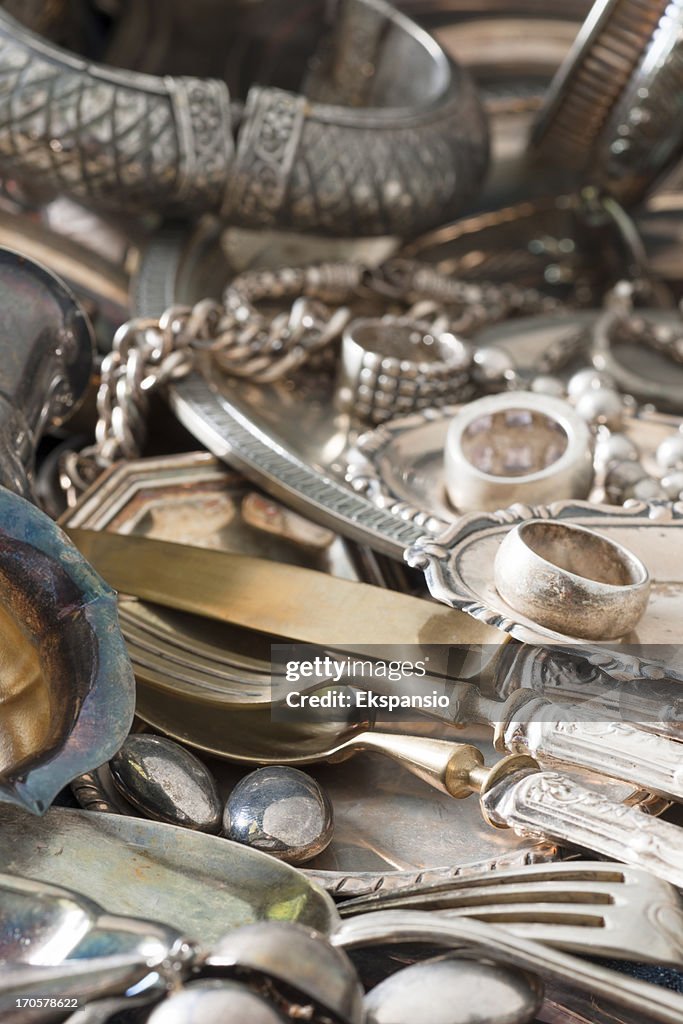 Antique Silverware and Old Silver Jewelry Background