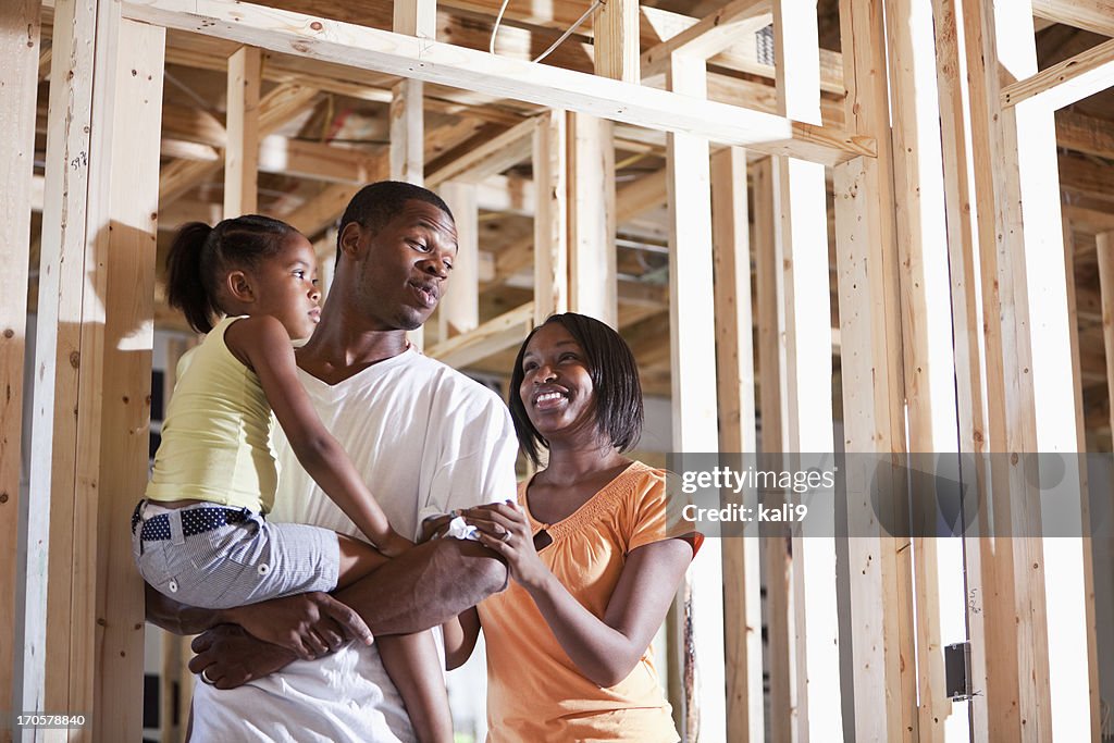 Family in house under construction