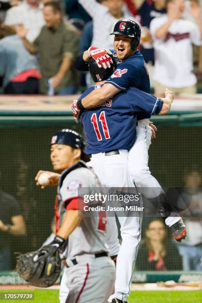 Drew Stubbs celebrates with Ryan Raburn of the Cleveland Indians after Stubbs scored to win the game in the ninth inning against the Washington...