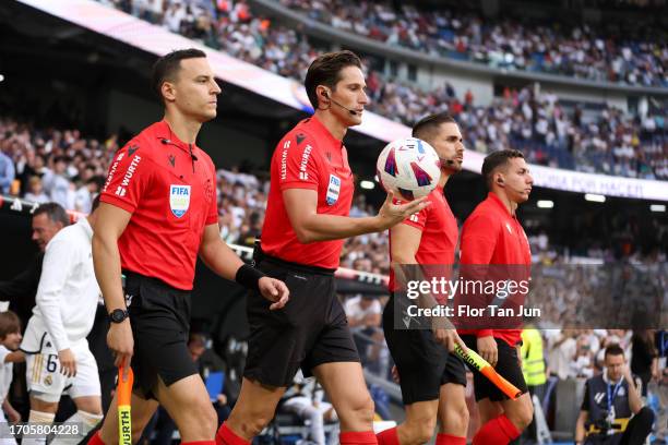 Referees Jose Luis Munuera Montero, Iñigo Prieto lopez de Cerain, Antonio Martinez Moreno and Jose David Martinez Montalban get into the pitch prior...