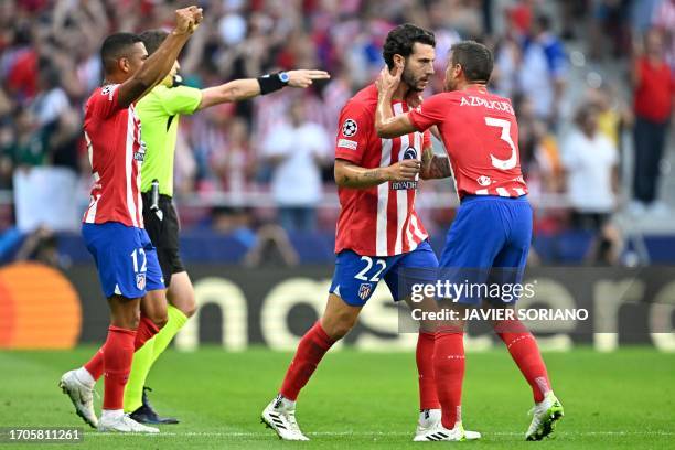 Atletico Madrid's Brazilian forward Samuel Lino, Atletico Madrid's Spanish defender Mario Hermoso and Atletico Madrid's Spanish defender Cesar...