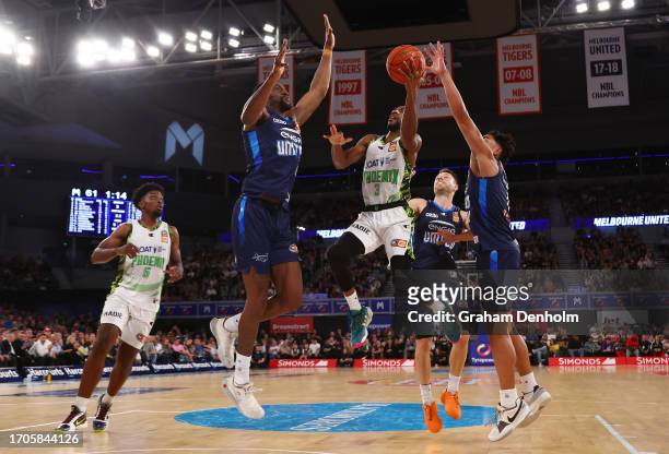 Will Cummings of the Phoenix drives at the basket during the round one NBL match between Melbourne United and South East Melbourne Phoenix at John...