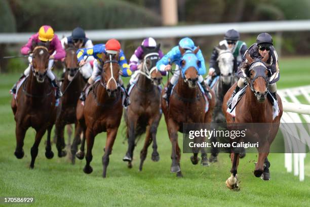 Glen Boss riding Mr O'ceirin races away to win the Printhouse Graphic Handicap during Melbourne racing at Moonee Valley Racecourse on June 15, 2013...