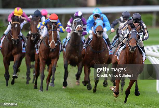 Glen Boss riding Mr O'ceirin races away to win the Printhouse Graphic Handicap during Melbourne racing at Moonee Valley Racecourse on June 15, 2013...