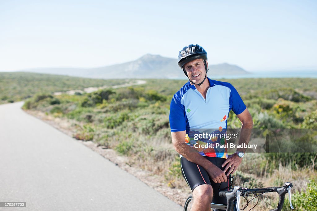 Man in helmet sitting on bicycle