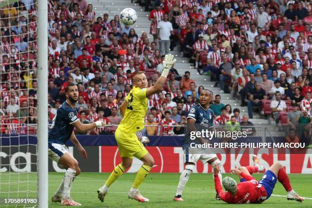 Atletico Madrid's French forward Antoine Griezmann attempts a bicycle kick and scores his team's second goal during the UEFA Champions League 1st...