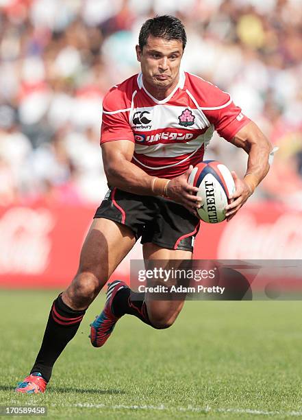 Craig Wing of Japan makes a break during the international friendly between Japan and Wales at Prince Chichibu Stadium on June 15, 2013 in Tokyo,...