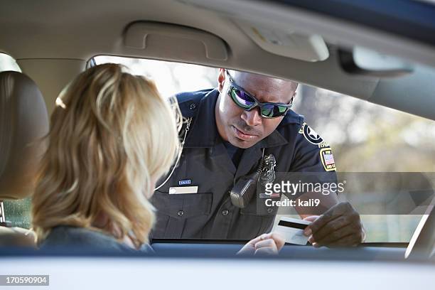 woman pulled over by police - traffic cop stock pictures, royalty-free photos & images