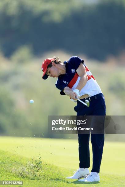 Jackson Byrd of The United States Team plays his second shot on the 12th hole in his match against Giovanni Binaghi during the singles matches on day...