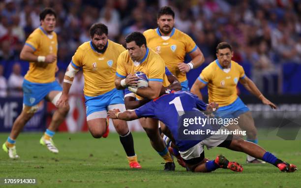 Facundo Gattas of Uruguay is tackled by Jason Benade of Namibia during the Rugby World Cup France 2023 match between Uruguay and Namibia at Parc...
