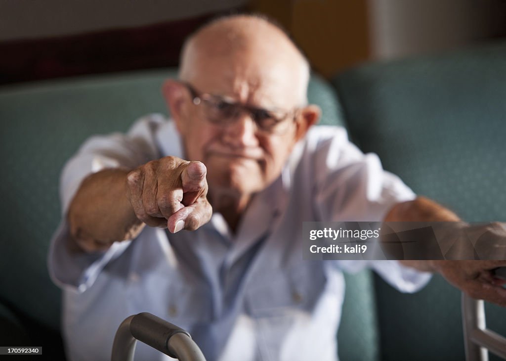 Senior man pointing