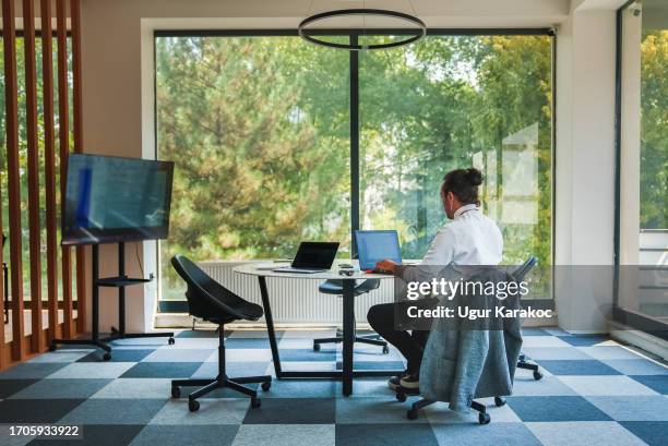 businessman working alone on conference table. - agency creative stockfoto's en -beelden