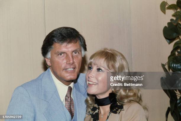 American actress Barbara Eden posing with fiancé Charles Fegert at his office in Chicago, September 1st 1977. Fegert is a marketing executive for the...