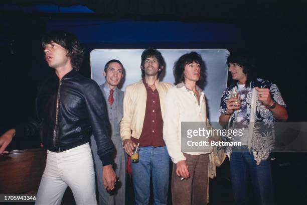 British rock band the Rolling Stones attending a party in New York, September 23rd 1977. Left to right: Mick Jagger, Charlie Watts, Keith Richards,...