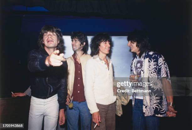 British rock band the Rolling Stones attending a party in New York, September 23rd 1977. Left to right: Mick Jagger, Charlie Watts, Keith Richards,...