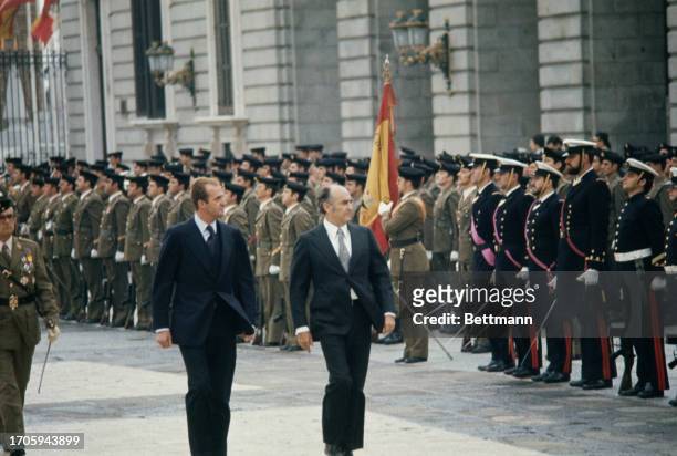 King Juan Carlos of Spain and President Jose Lopez Portillo of Mexico inspecting a guard of honour at the Royal Palace in Madrid, October 8th 1977.