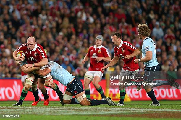 Paul O'Connell of the Lions is tackled during the match between the Waratahs and the British & Irish Lions at Allianz Stadium on June 15, 2013 in...