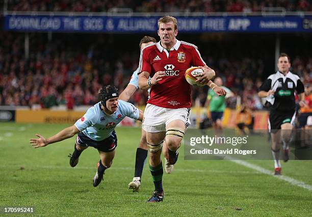 Tom Croft of the Lions breaks clear to score a try during the match between the NSW Waratahs and the British & Irish Lions at Allianz Stadium on June...